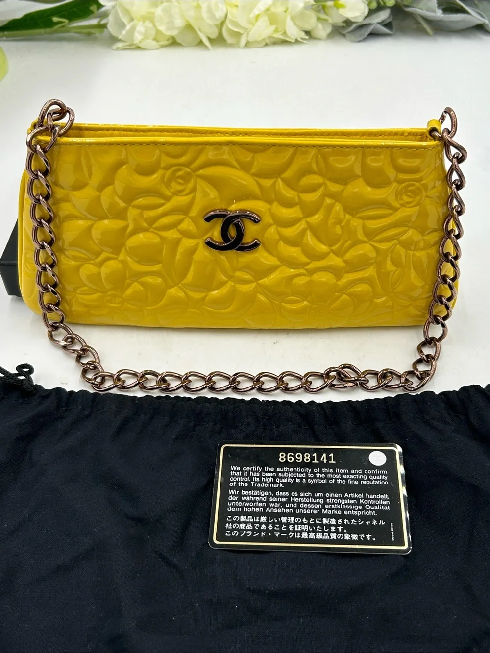Women's Chanel patent leather floral embossed shoulder bag made in Italy